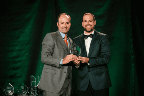 Sean Filippini accepting an award on stage